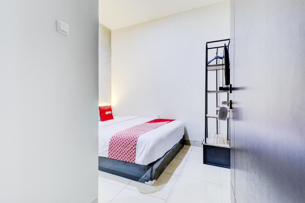 Postel nebo postele na pokoji v ubytování OYO 90215 Ada Residence