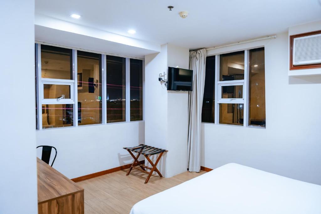TV a/nebo společenská místnost v ubytování S Hotel & Residences