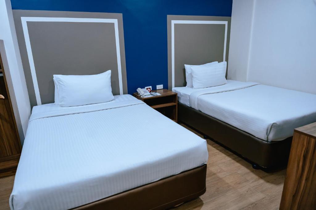 Postel nebo postele na pokoji v ubytování S Hotel & Residences
