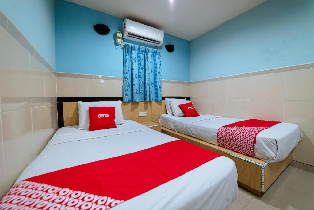 Postel nebo postele na pokoji v ubytování OYO 90208 Milion Inn