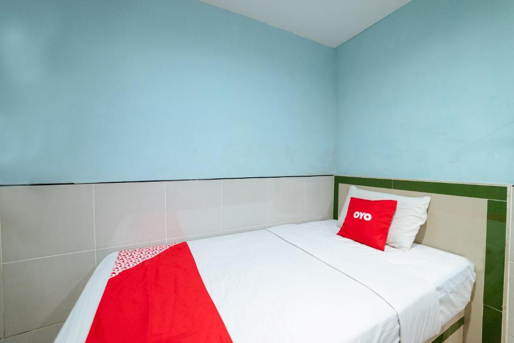 Postel nebo postele na pokoji v ubytování OYO 90208 Milion Inn