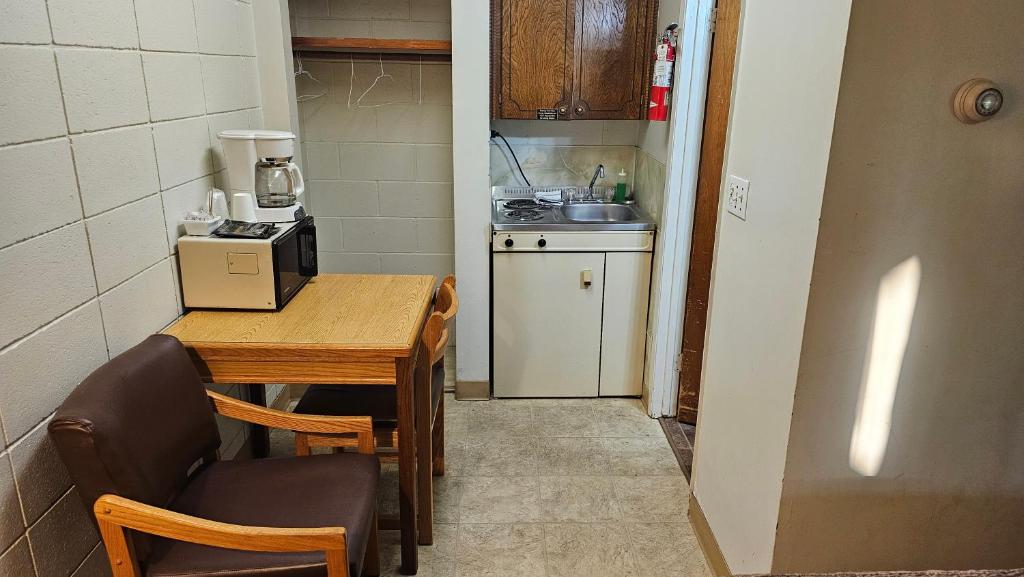 Kuchyň nebo kuchyňský kout v ubytování Camelot Court Motel
