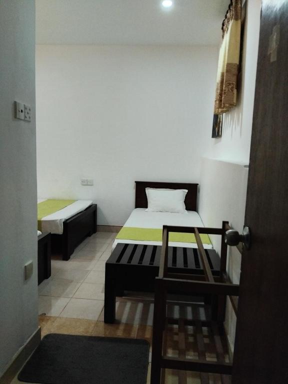 Postel nebo postele na pokoji v ubytování Paradise Residence Hanthana