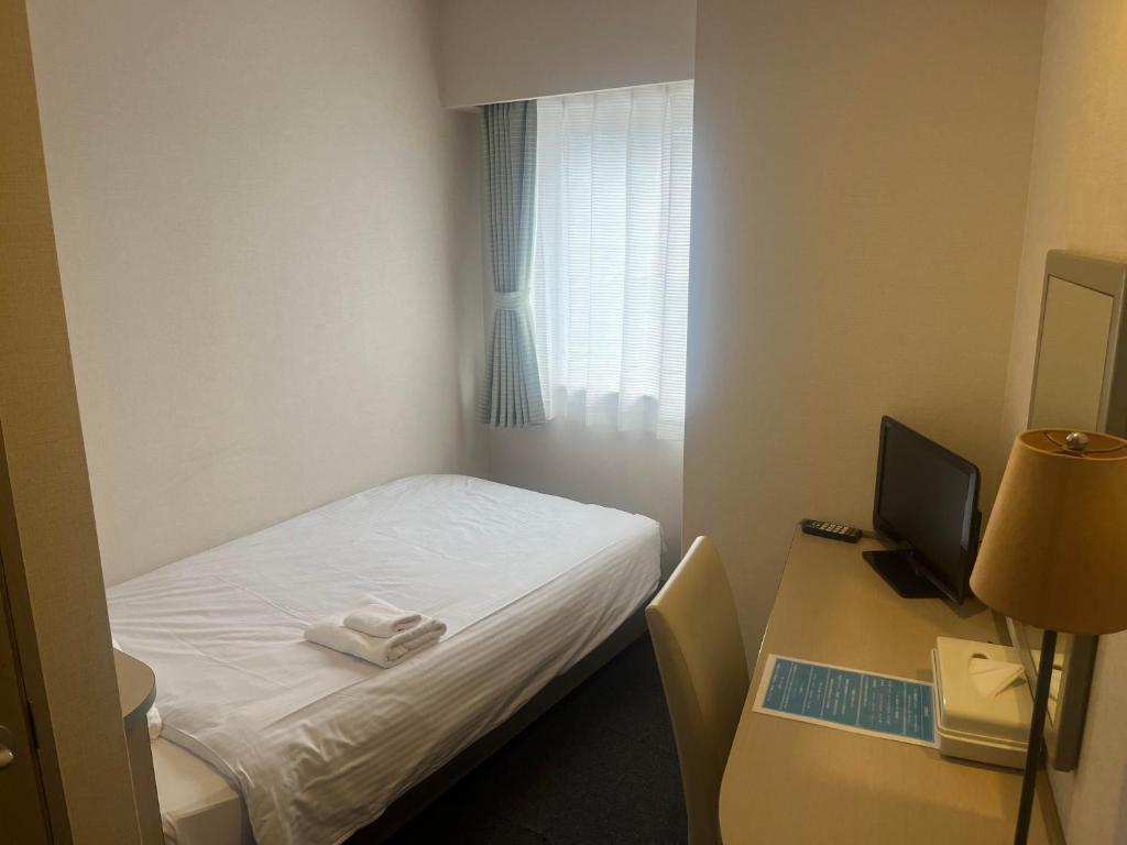 Postel nebo postele na pokoji v ubytování Hotel Kokomo