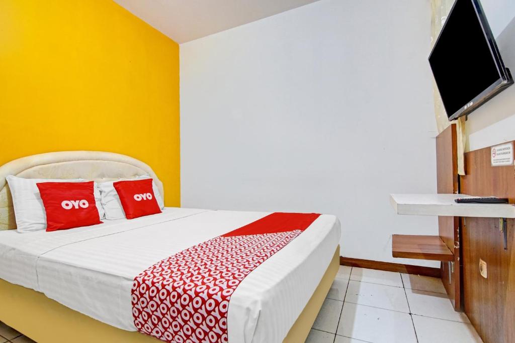 Ένα ή περισσότερα κρεβάτια σε δωμάτιο στο Hotel O Mall Of Indonesia