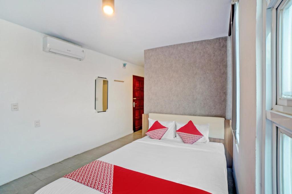 Postel nebo postele na pokoji v ubytování Super OYO 90559 Gamacity Residence