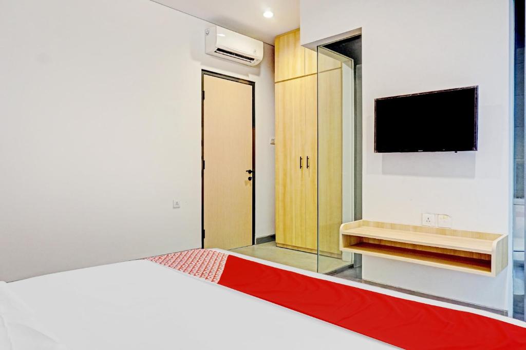 Postel nebo postele na pokoji v ubytování Super OYO Capital O 90635 Tango Juliet Residence