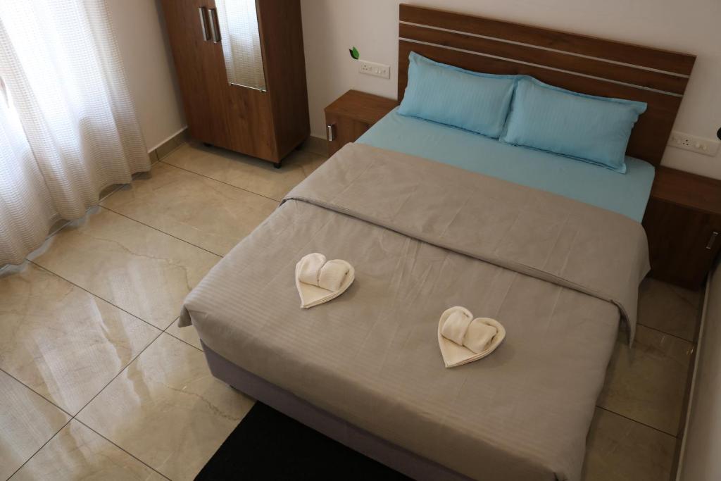 Postel nebo postele na pokoji v ubytování Asprin Homestay