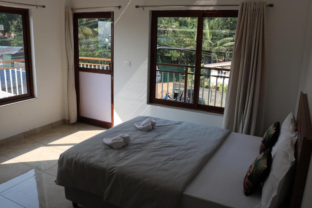 Postel nebo postele na pokoji v ubytování Asprin Homestay