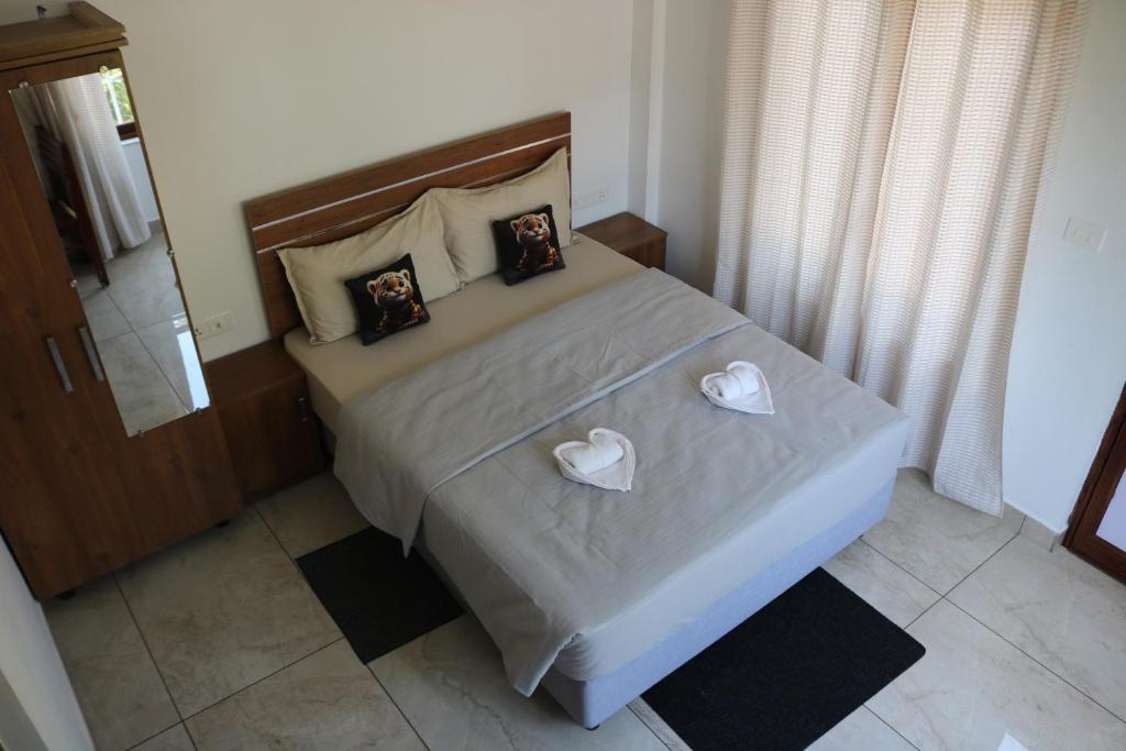 Postel nebo postele na pokoji v ubytování Asprin Homestay