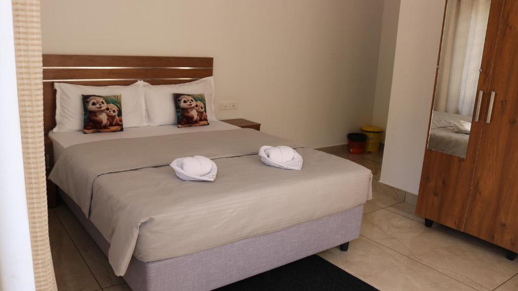 Postel nebo postele na pokoji v ubytování Asprin Homestay