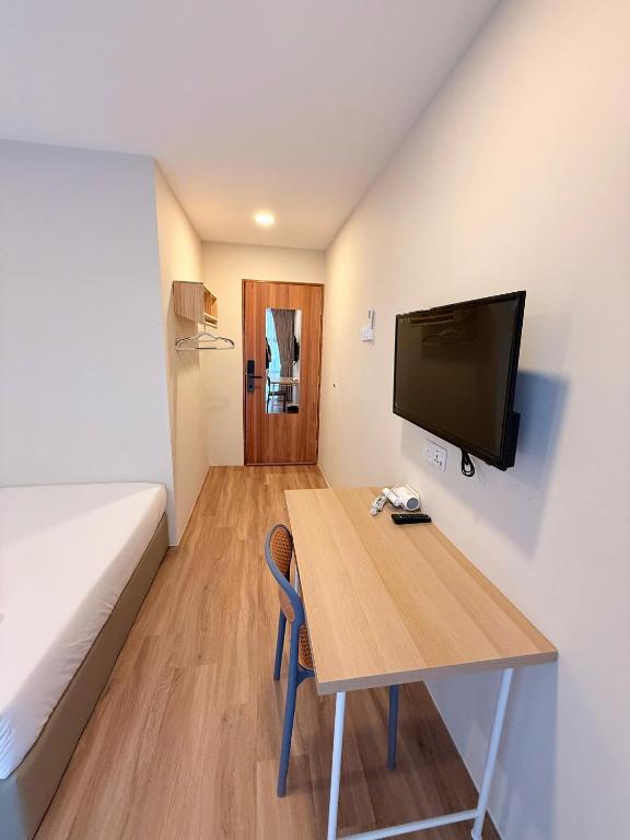 TV i/ili multimedijalni sistem u objektu TwinTree Kelawai