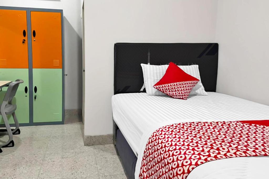 Postel nebo postele na pokoji v ubytování OYO 90708 Kbr Home