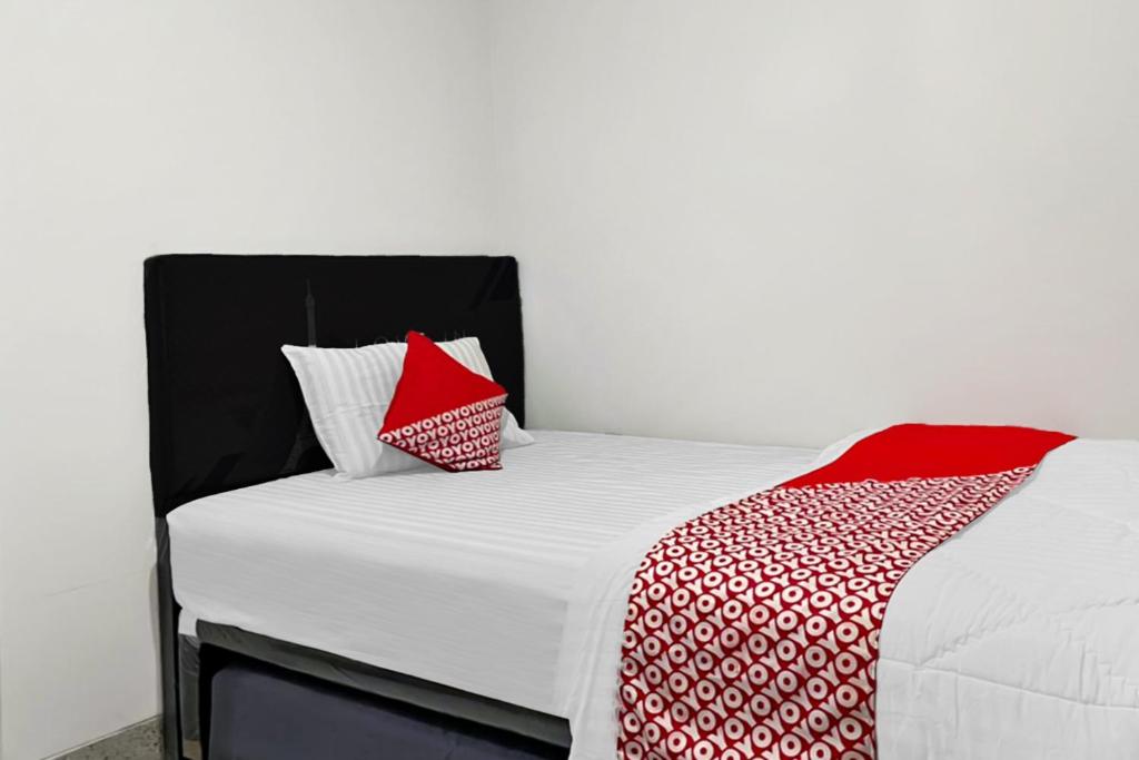 Postel nebo postele na pokoji v ubytování OYO 90708 Kbr Home