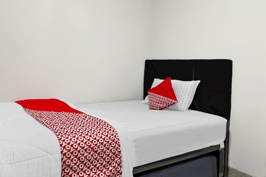 Postel nebo postele na pokoji v ubytování OYO 90708 Kbr Home