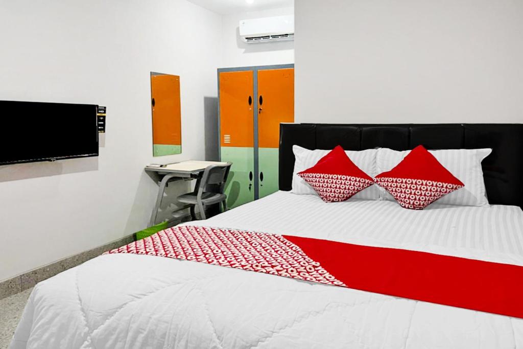 Postel nebo postele na pokoji v ubytování OYO 90708 Kbr Home