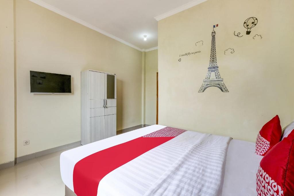 Postel nebo postele na pokoji v ubytování SUPER OYO 90905 Dangau Datuk Guesthouse