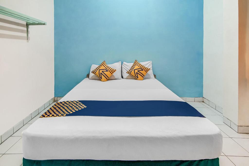 Postel nebo postele na pokoji v ubytování SPOT ON 90964 Hotel Margadana
