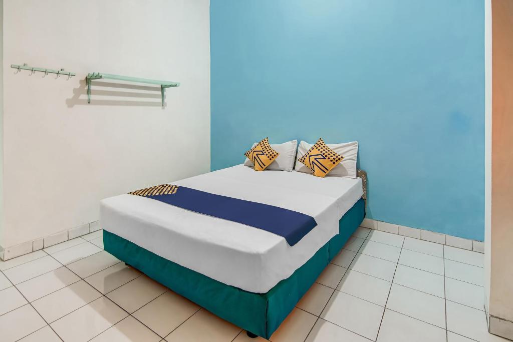 Postel nebo postele na pokoji v ubytování SPOT ON 90964 Hotel Margadana