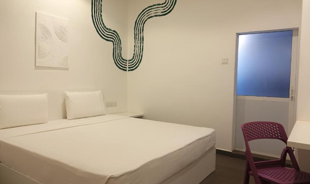 Postel nebo postele na pokoji v ubytování Hotel J Negombo