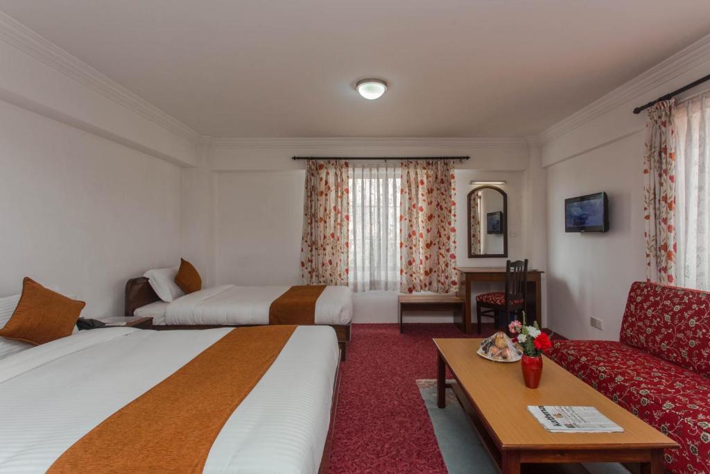 Postel nebo postele na pokoji v ubytování Fuji Hotel