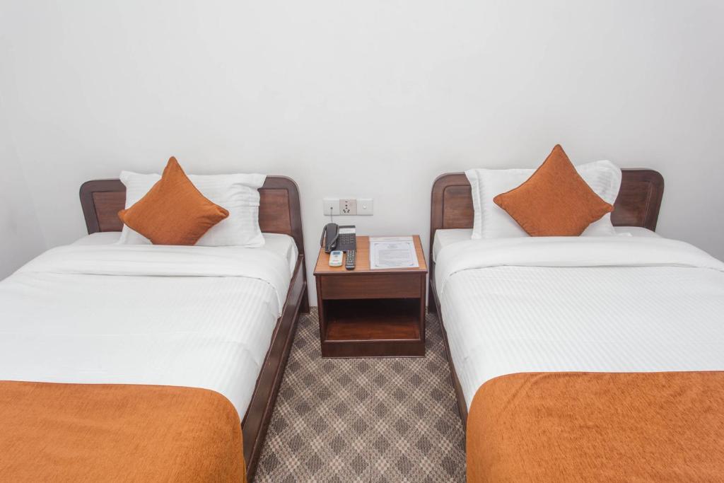 Postel nebo postele na pokoji v ubytování Fuji Hotel