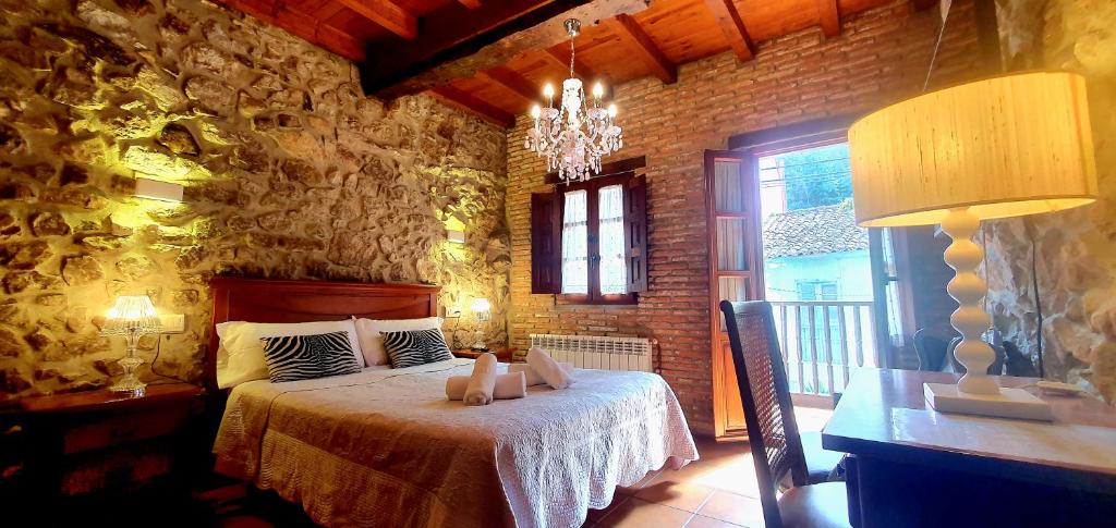 A bed or beds in a room at El Juacu