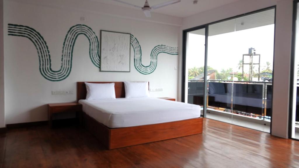 Postel nebo postele na pokoji v ubytování Hotel J Negombo