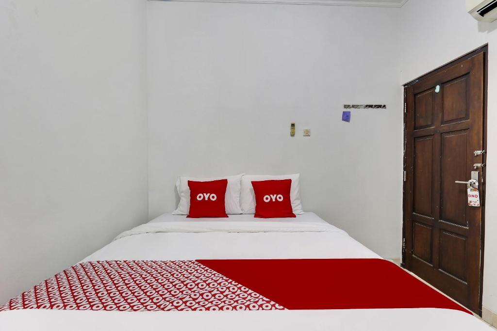 Postel nebo postele na pokoji v ubytování OYO 91082 Nathania Exclusive