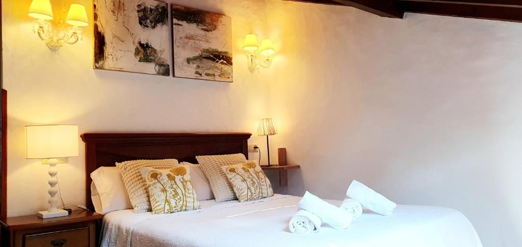 A bed or beds in a room at El Juacu