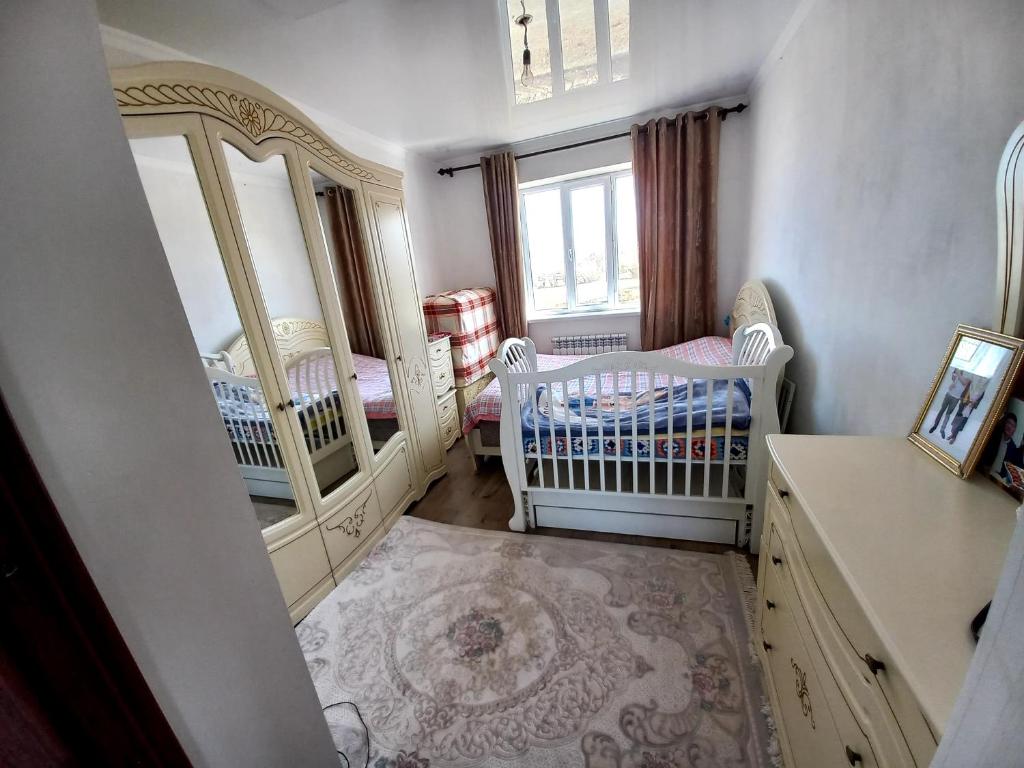 Postel nebo postele na pokoji v ubytování Beksultan guest house