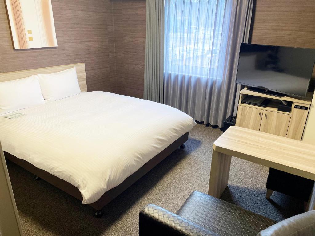 TV a/nebo společenská místnost v ubytování Hotel Route-Inn Takefu Inter