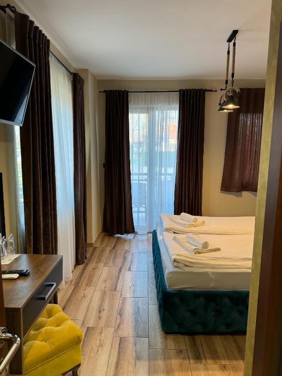 Letto o letti in una camera di ATOS Srebrno jezero - Villa and Restaurant