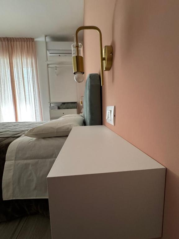 A bed or beds in a room at Profumo d'aMARE
