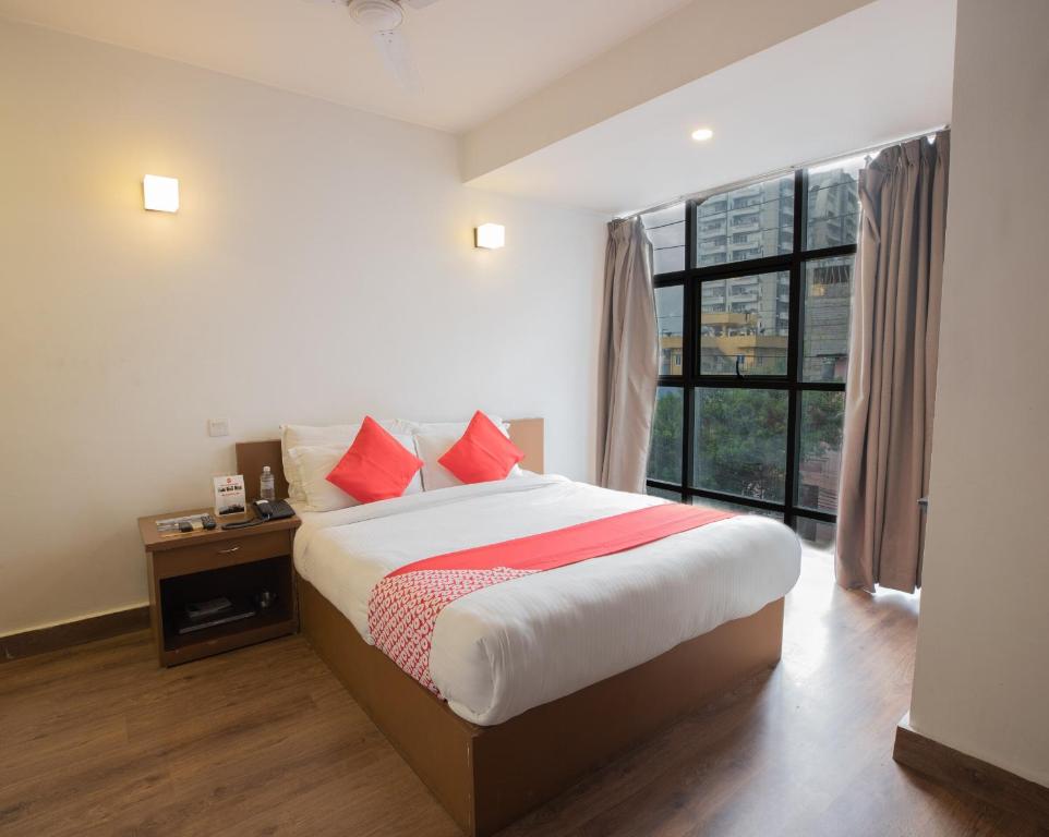 Postel nebo postele na pokoji v ubytování OYO 123 Hotel Prince Plaza