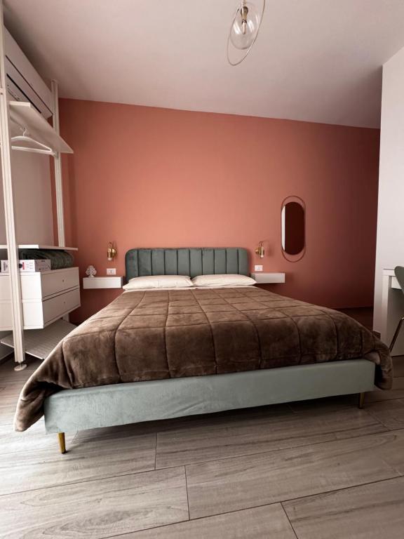 A bed or beds in a room at Profumo d'aMARE