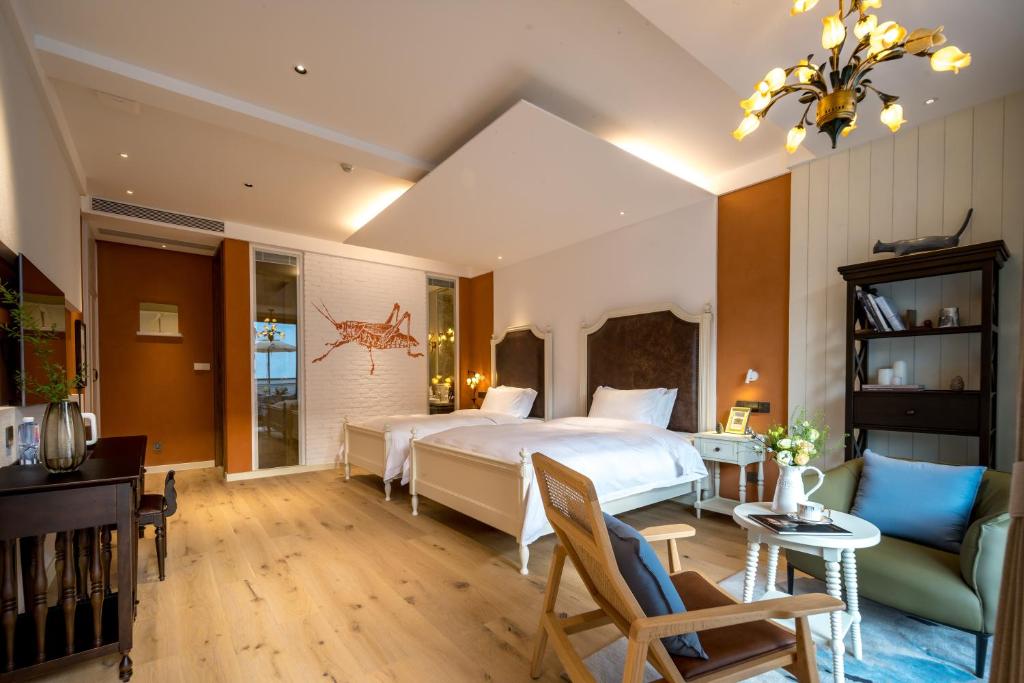 Postel nebo postele na pokoji v ubytování Moganshan Xinyuanju Homestay