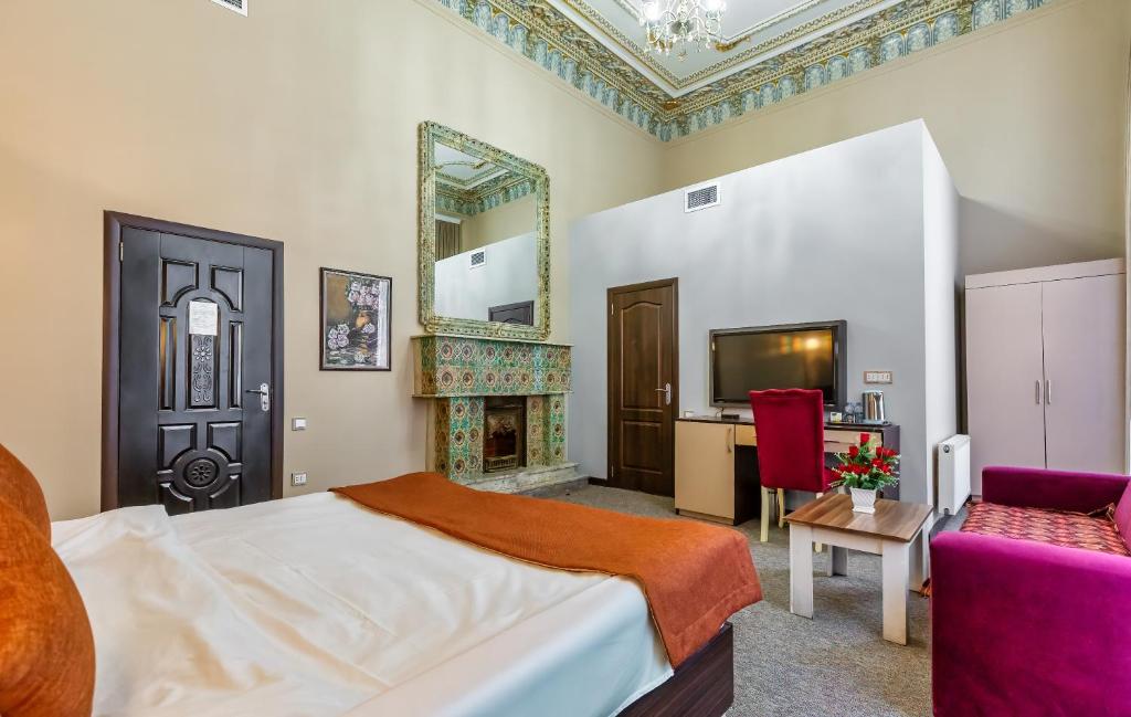Postel nebo postele na pokoji v ubytování Garden Inn by NHG