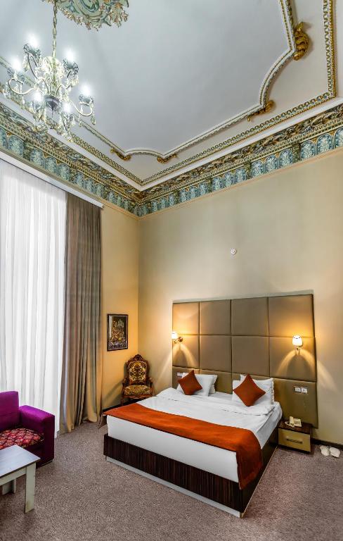 Postel nebo postele na pokoji v ubytování Garden Inn by NHG