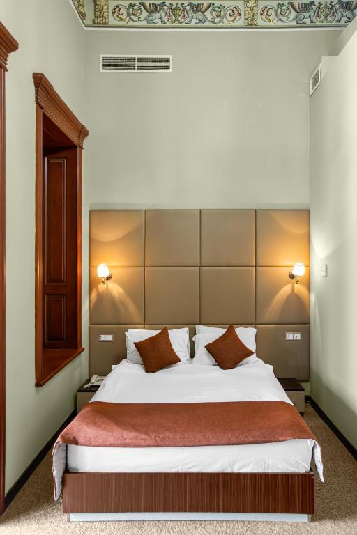 Postel nebo postele na pokoji v ubytování Garden Inn by NHG