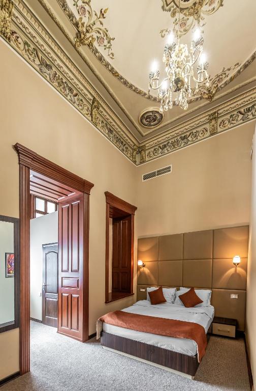 Postel nebo postele na pokoji v ubytování Garden Inn by NHG