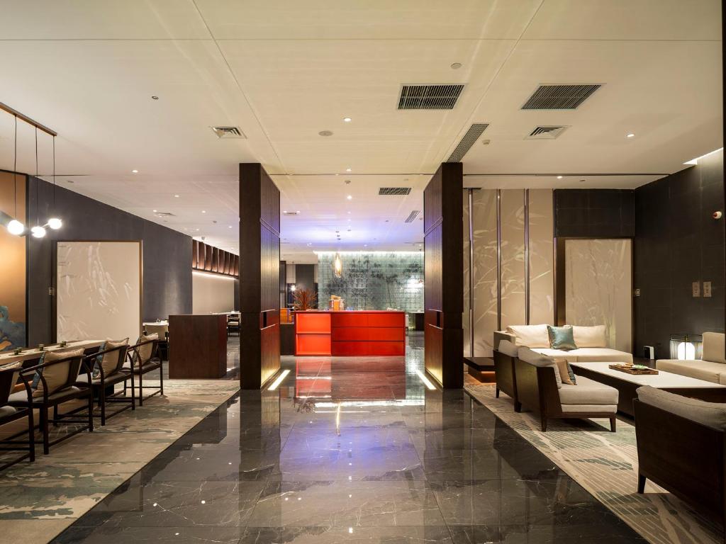 Zhengzhou East Station Longzi Lake University Area Qianna Yuanxi Hotel的休息区