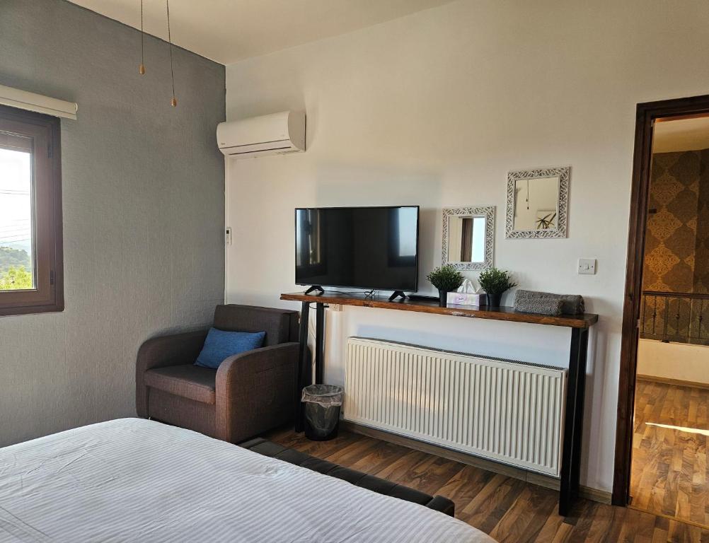 Postel nebo postele na pokoji v ubytování Kasparis View Residence