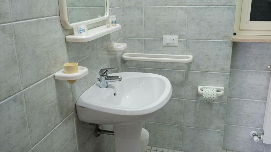 a bathroom with a sink and a toilet at Smart and Sea in Tortoreto Lido