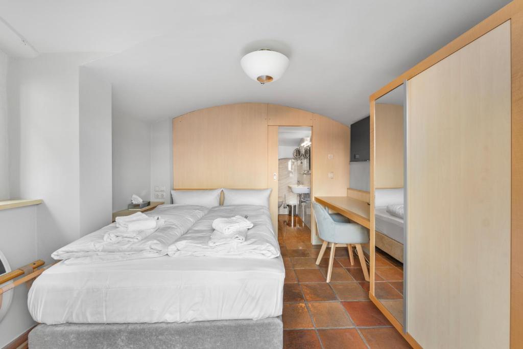 Postel nebo postele na pokoji v ubytování Hotel Friedrichstadt
