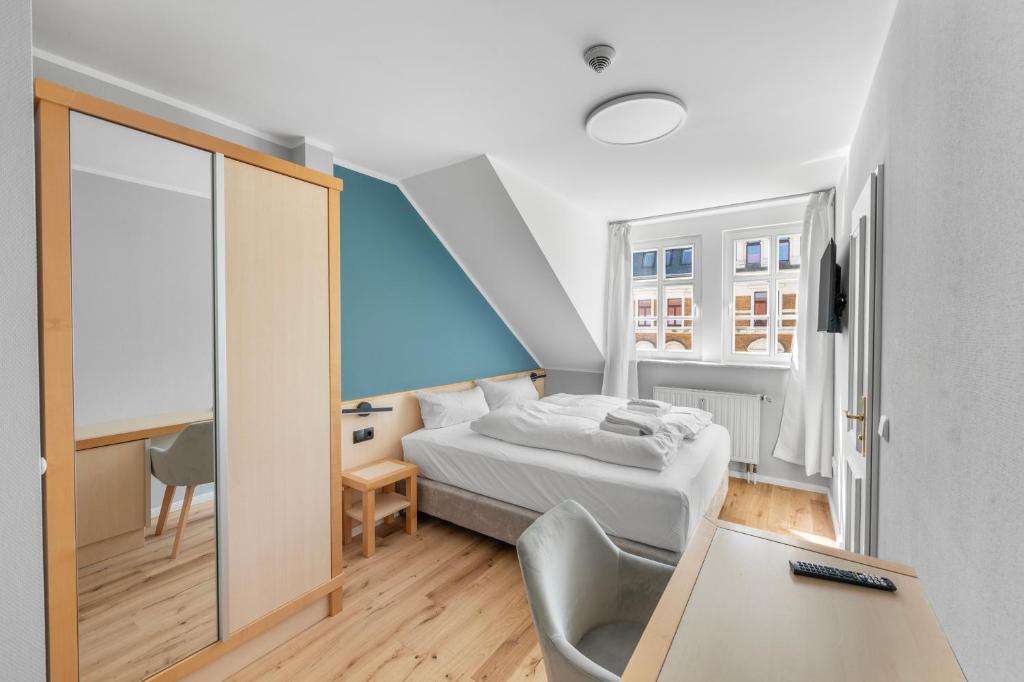 Postel nebo postele na pokoji v ubytování Hotel Friedrichstadt