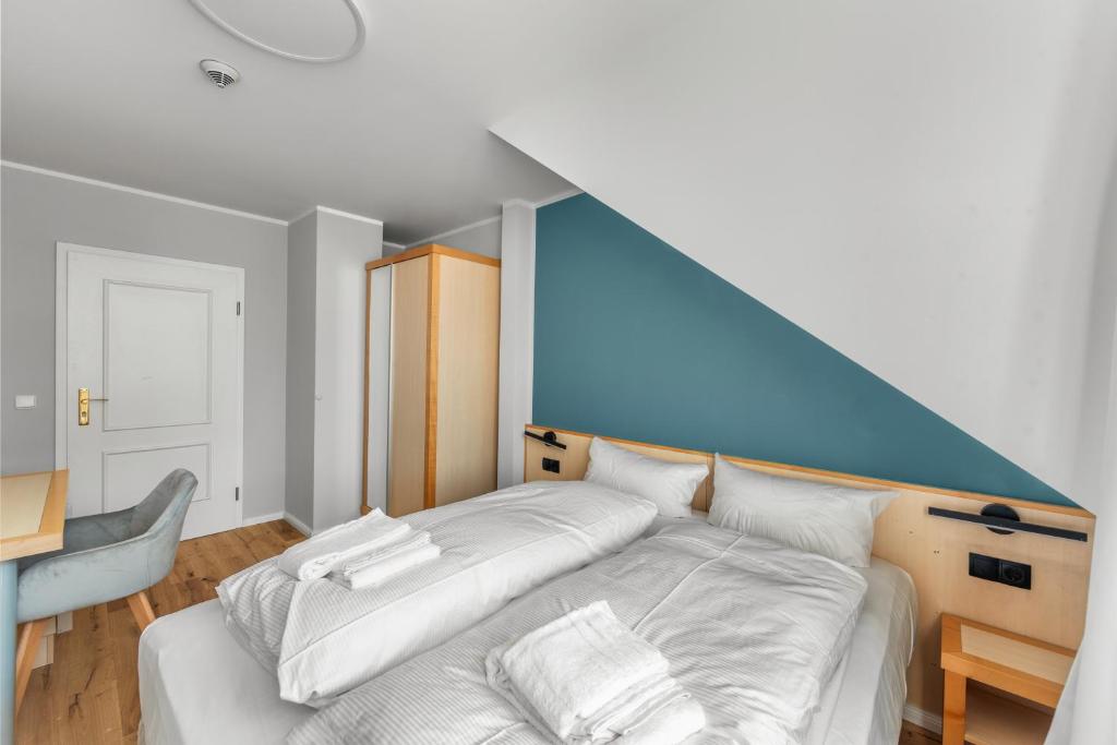Postel nebo postele na pokoji v ubytování Hotel Friedrichstadt