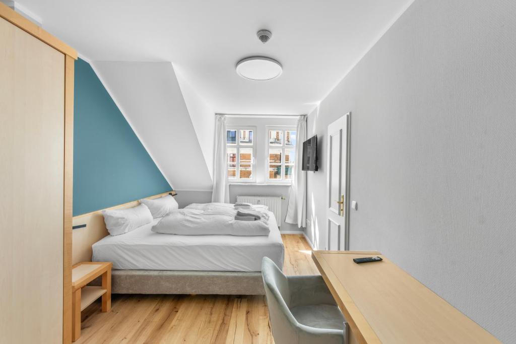 Postel nebo postele na pokoji v ubytování Hotel Friedrichstadt