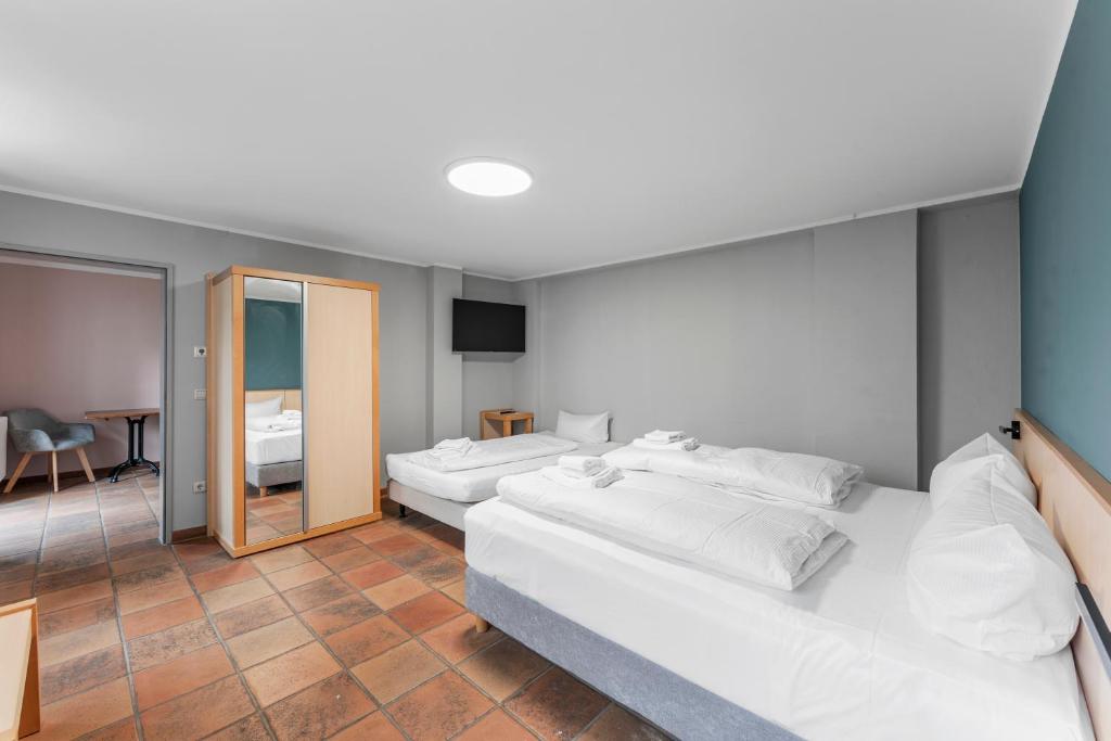 Postel nebo postele na pokoji v ubytování Hotel Friedrichstadt