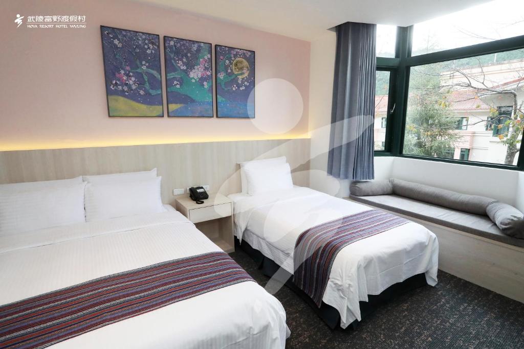 Postel nebo postele na pokoji v ubytování Hoya Resort, Wuling